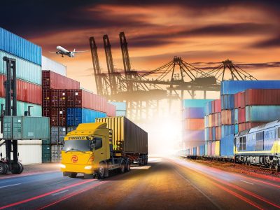 Business logistics and transportation concept of containers cargo freight ship and cargo plane with working crane in shipyard at sunset sky, logistic import export and transport industry background